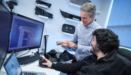 two engineers troubleshooting plastic part design